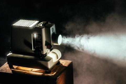 A film projector represents library movie screenings
