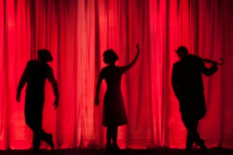 Library performances are represented by dancers silhouetted in front of a red curtain.