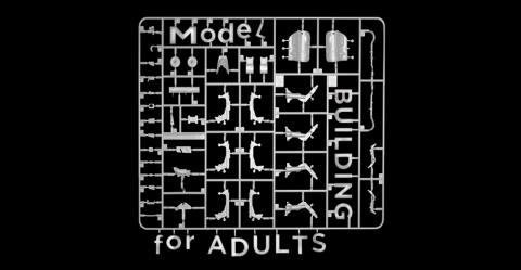 Parts of a scale model kit which spell out "Model Building for Adults".